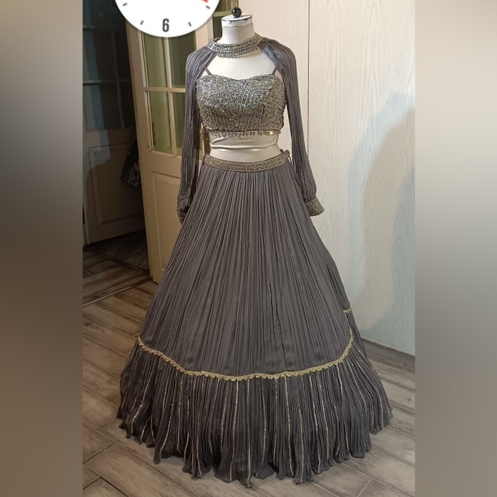 An ash violet color Lehenga And a crop top with a long Cape around the neck